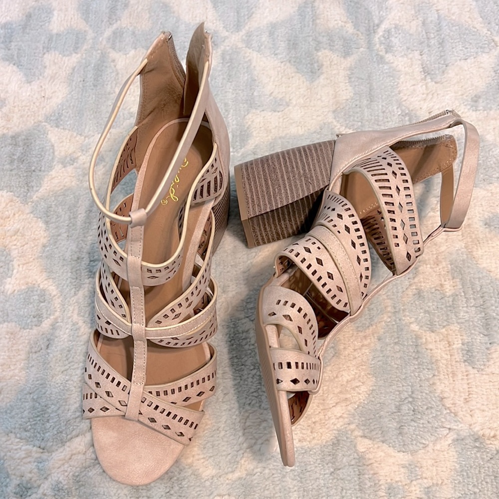 Tan heeled sandals. Size 10. Never worn. Runs big.